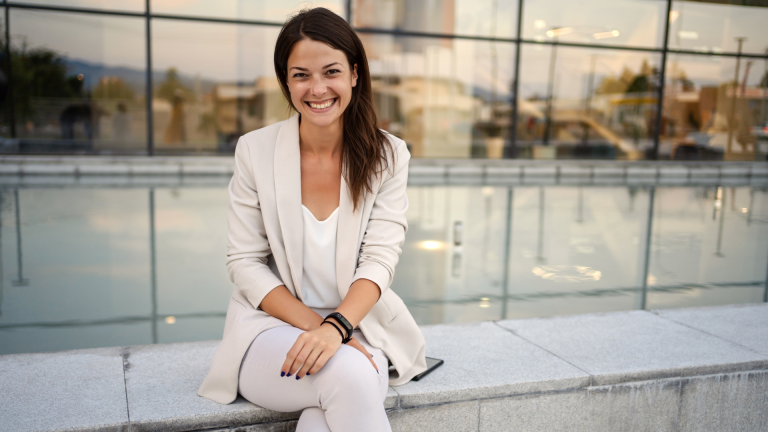 Business woman smiling after fibroid removal treatment at Phase II center for women's health