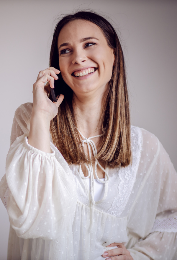 Woman calling for an appointment at Phase II Center for Women's Health in Millcreek, UT