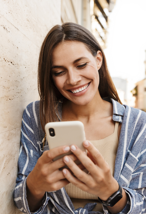 Woman on phone scheduling her checkup at Phase II Center for Women's Health in Millcreek, UT
